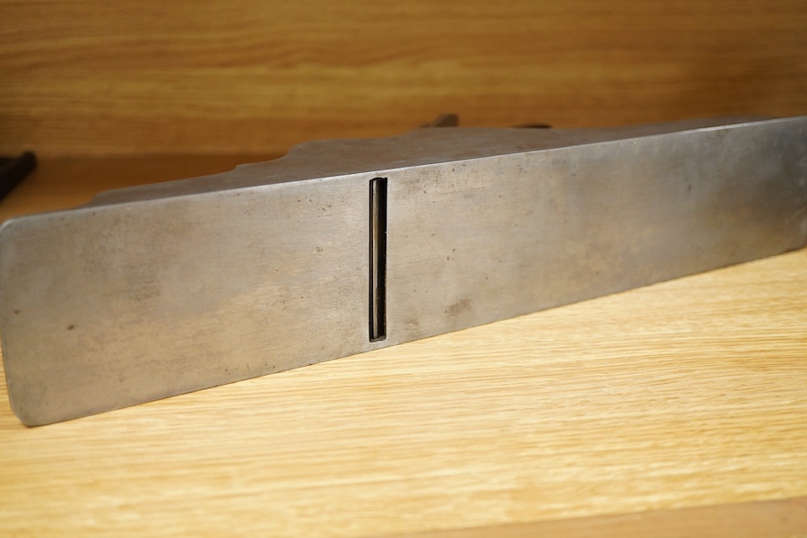 A Stewart Spiers steel 15 1/2” panel plane, stamped with Spiers, Ayr to the brass lever cap, chip breaker and iron, with rosewood infill